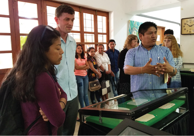 Dr. Iván Batún, Museums Connect program coordinator for Mexico, explains the significance of some of the archival documents in the Archivo General del Estado de Yucatán, of which he was formerly director.